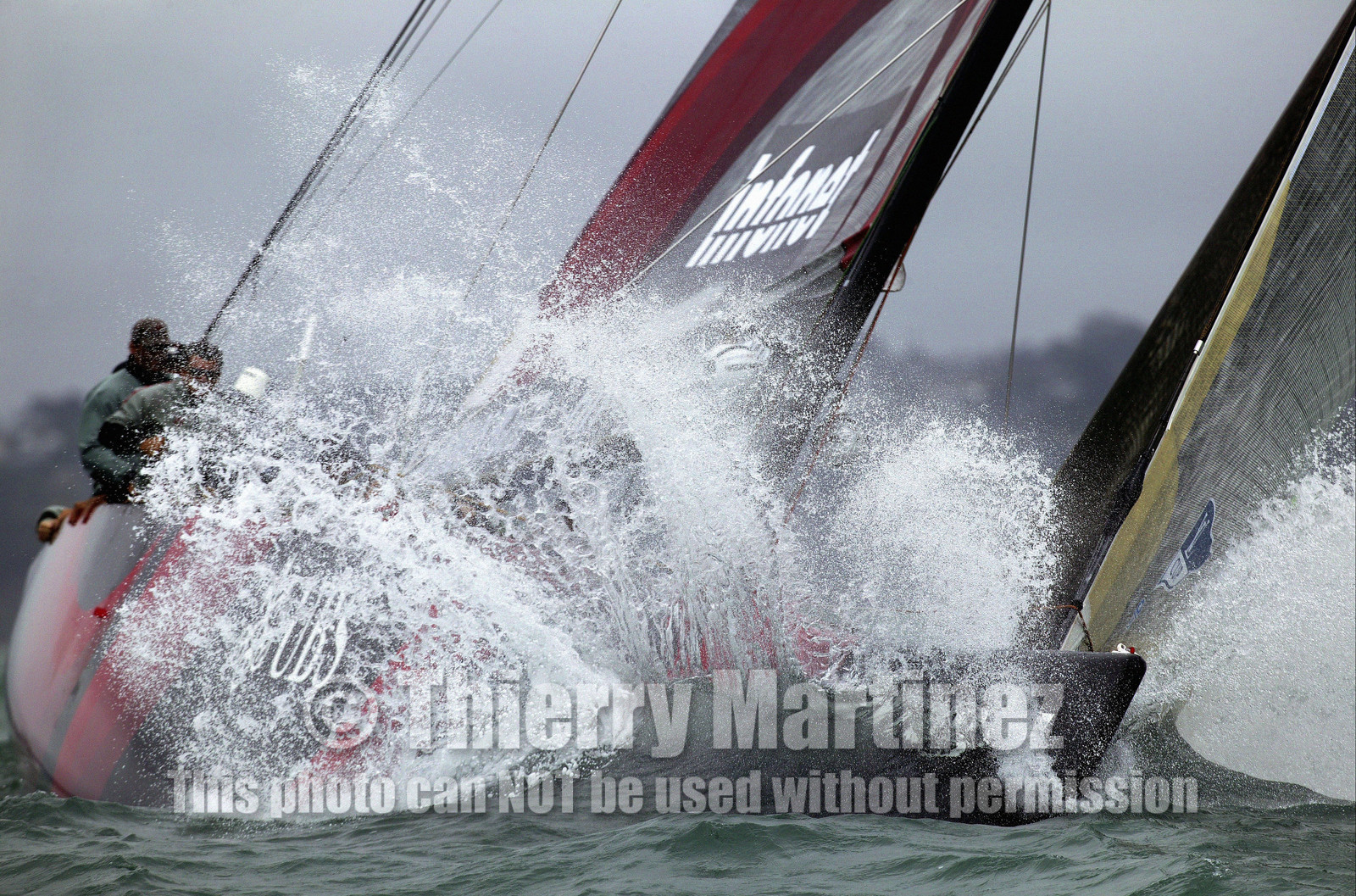 03_1103D © Th.Martinez. Auckland   New Zealand. 28th February 2003 America's Cup 2003. Day 4, Alinghi (SUI64) vs Team New Zealand (NZL82). SUI64 crew warming up before the start...