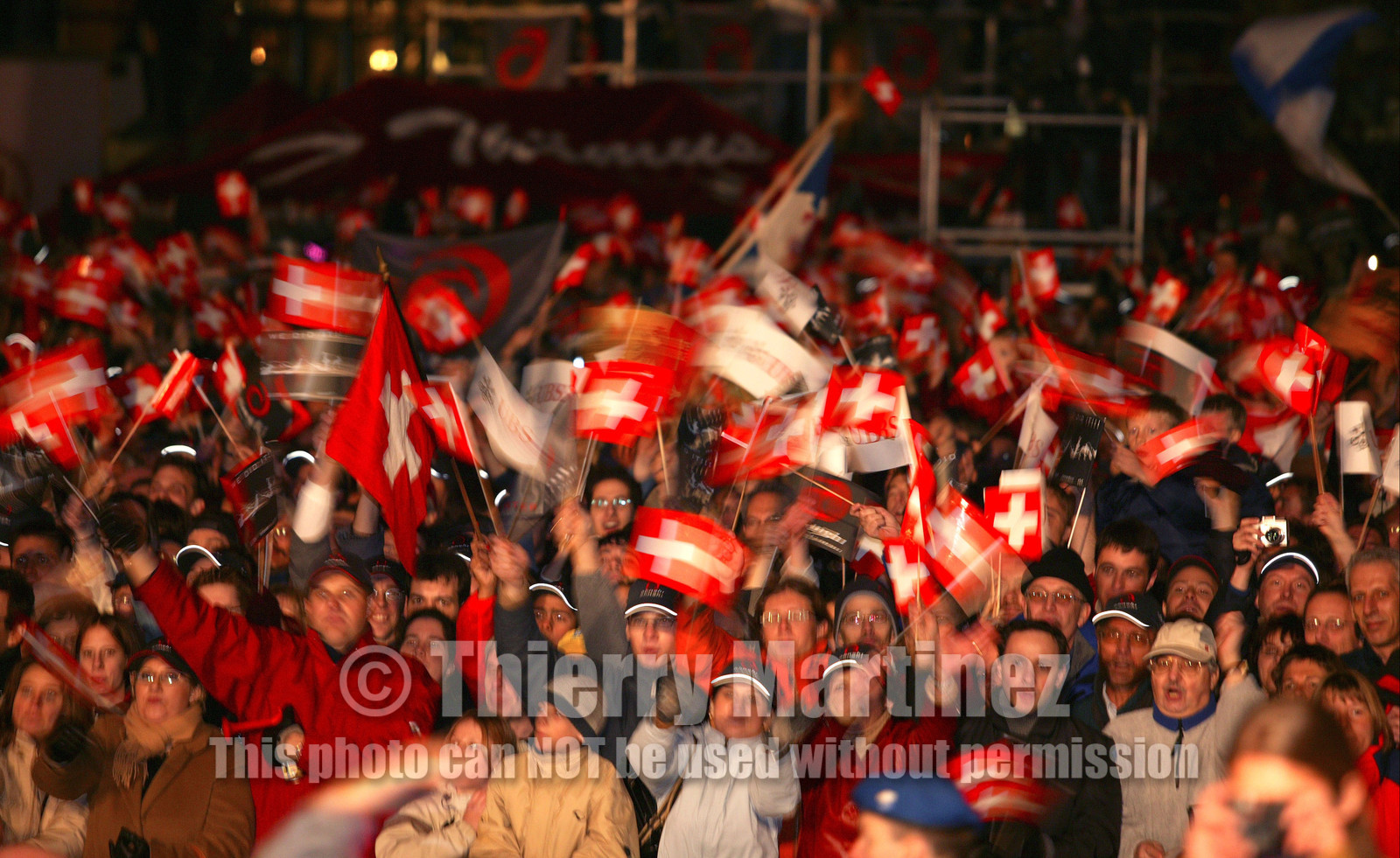 03_2258D ©Th.Martinez.Geneva , Switzerland. America's Cup 2003. 8th March 2003.Alinghi Team winner of America's Cup 2003..Welcome to Alinghi Team in Geneva.Alinghi supporters at La Rotonde...