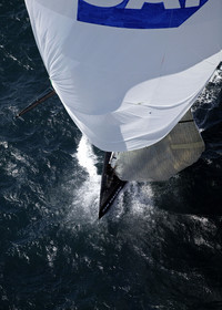 03_0197D ©Th.Martinez - Auckland (NZ) . America's Cup 2003. 18th February 2003. Day 3..Alinghi (SUI 64) vs Team NZ (NZL 82) .Team NZ 's crew droping head sail after setting up spinnaker at upwind mark....