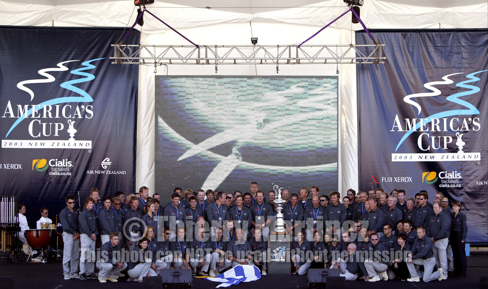 03_1485D ©Th.Martinez  - Auckland-New Zealand. America's Cup 2003. 3rd March 2003. .America's Cup prizegiving.All Alinghi Team winner of America's Cup 2003 on stage ...