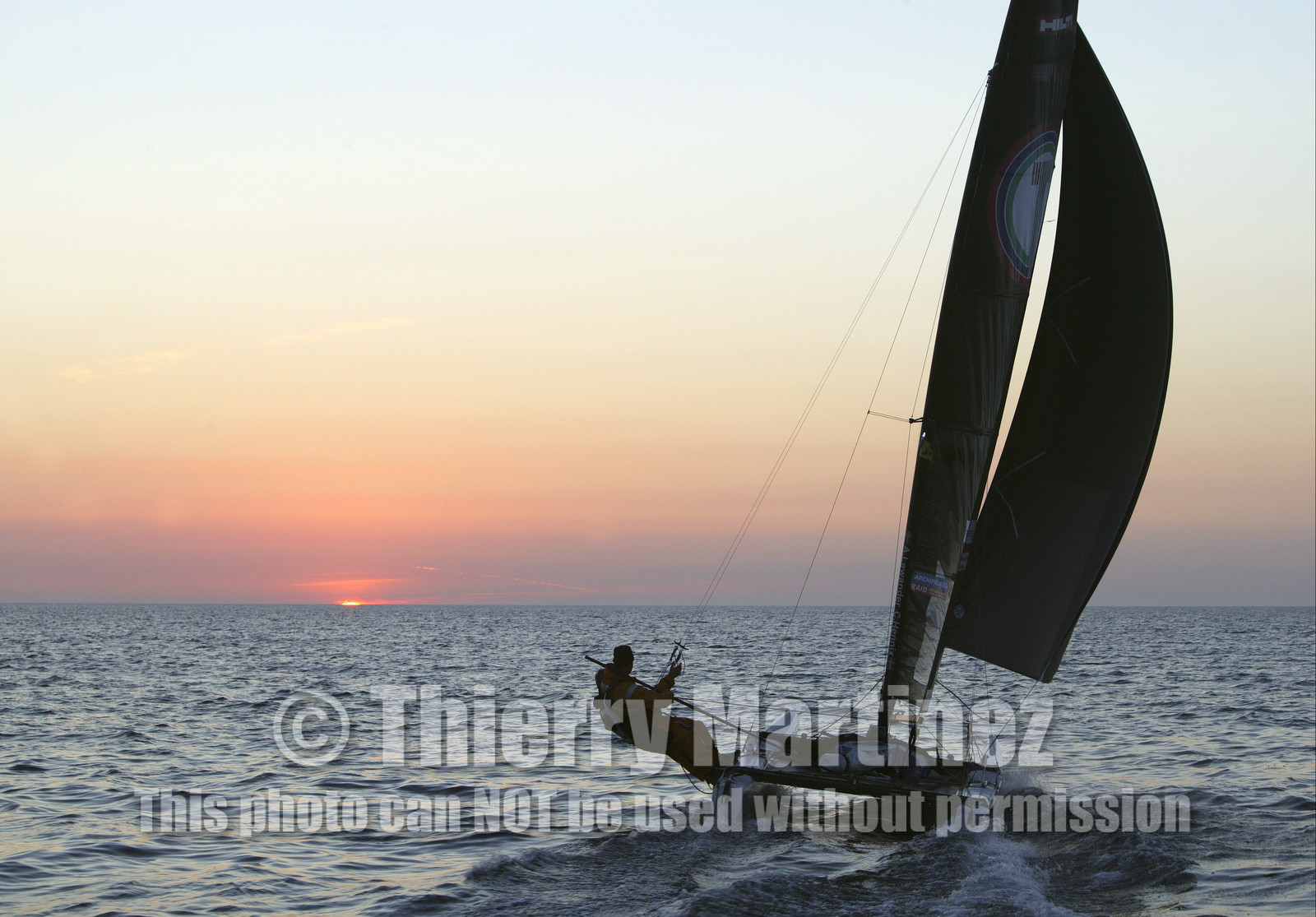 03_3179D © Th.Martinez,STOCKHOLM ARCHIPELAGO SWEDEN,9 07 03-Archipelago Raid (2003)  Leg 2.First sunrise on Archipelago Raid 2003. TIDERMANS Anders Lewander (SWE) & Calle Hendix (SWE)