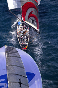 03_0975D © Th.Martinez . Auckland   New Zealand. 18th February 2003 America's Cup 2003, Day 3 Alinghi(SUI64) vs Team New Zealand(NZL82).Alinghi Team leading NZL 82 in last downwind leg.