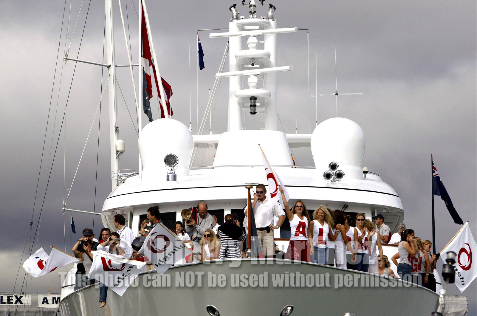 03_1162D © Th.Martinez . Auckland   New Zealand. 1st March 2003 America's Cup 2003. Day 5 cancelled not enough wind. Alinghi (SUI64) vs Team New Zealand (NZL82)..Alinghi's supporters on board VAVA.