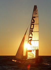03_3248D © Th.Martinez,STOCKHOLM ARCHIPELAGO SWEDEN, 10 07 03-Archipelago Raid (2003)  Day 3..Team NOKIA-Kempff  Magnus Nordstrom (SWE)& Joakim Kempff (SWE) sailing in sunset light on the way back from Finland to Sweden.