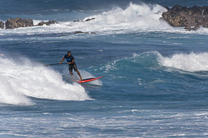 Stand Up Paddle  in waves at Hookip'a Beach - North Shore Maui - Hawaii.