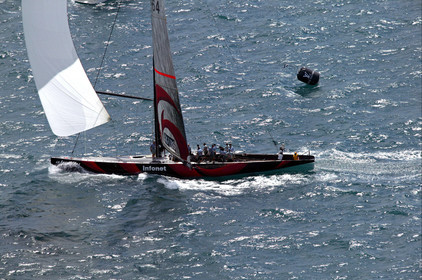 03_0966D © Th.Martinez . Auckland   New Zealand. 18th February 2003 America's Cup 2003, Day 3 Alinghi(SUI64) vs Team New Zealand(NZL82) Alinghi team crossing the finish line in first on race 3