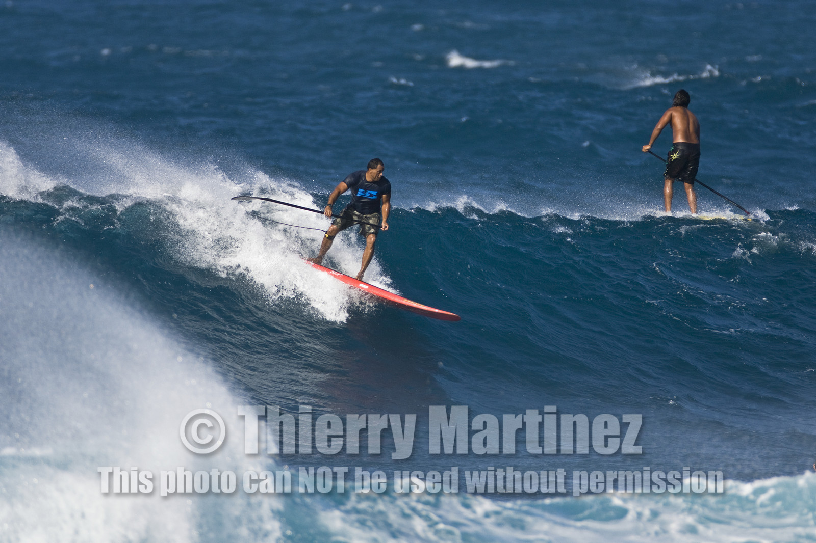 Stand Up Paddle  in waves at Hookip'a Beach - North Shore Maui - Hawaii.