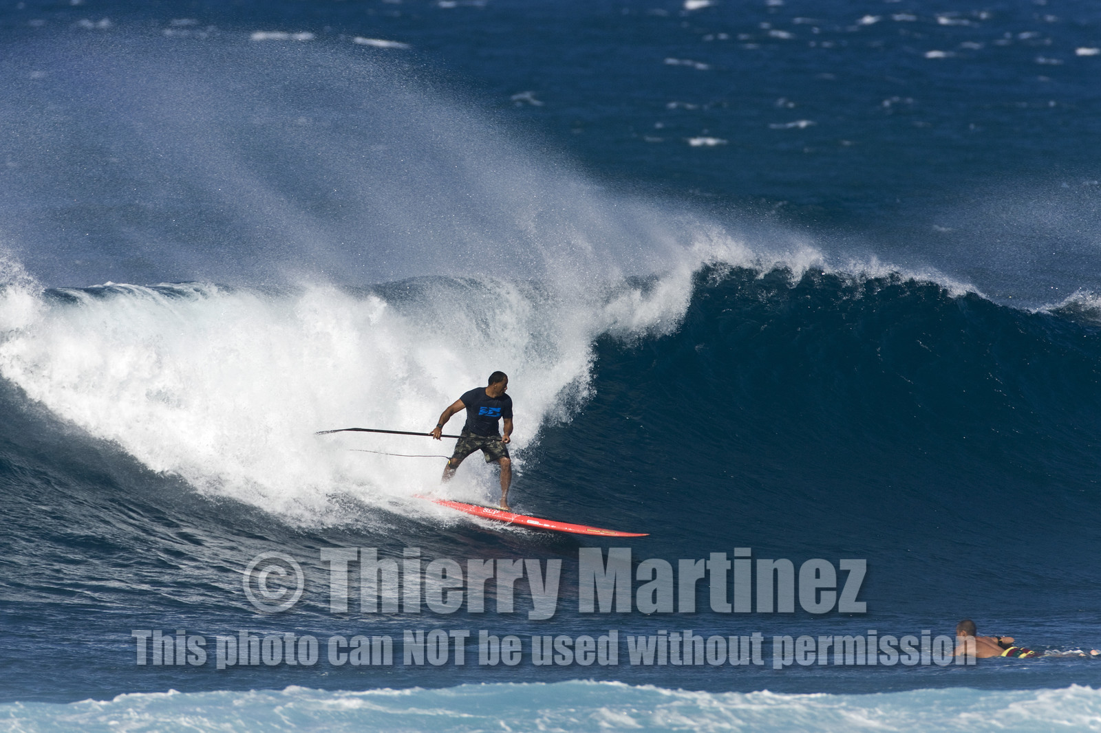 Stand Up Paddle  in waves at Hookip'a Beach - North Shore Maui - Hawaii.