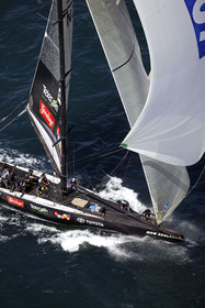 03_0196D ©Th.Martinez - Auckland (NZ) . America's Cup 2003. 18th February 2003. Day 3..Alinghi (SUI 64) vs Team NZ (NZL 82) .Team NZ 's crew droping head sail after setting up spinnaker at upwind mark.....