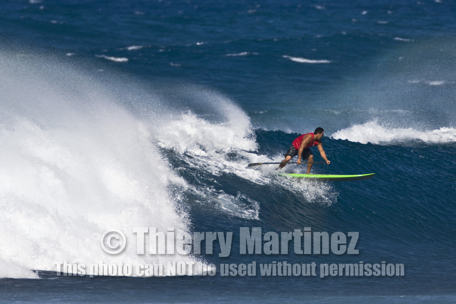 Stand Up Paddle  in waves at Hookip'a Beach - North Shore Maui - Hawaii.