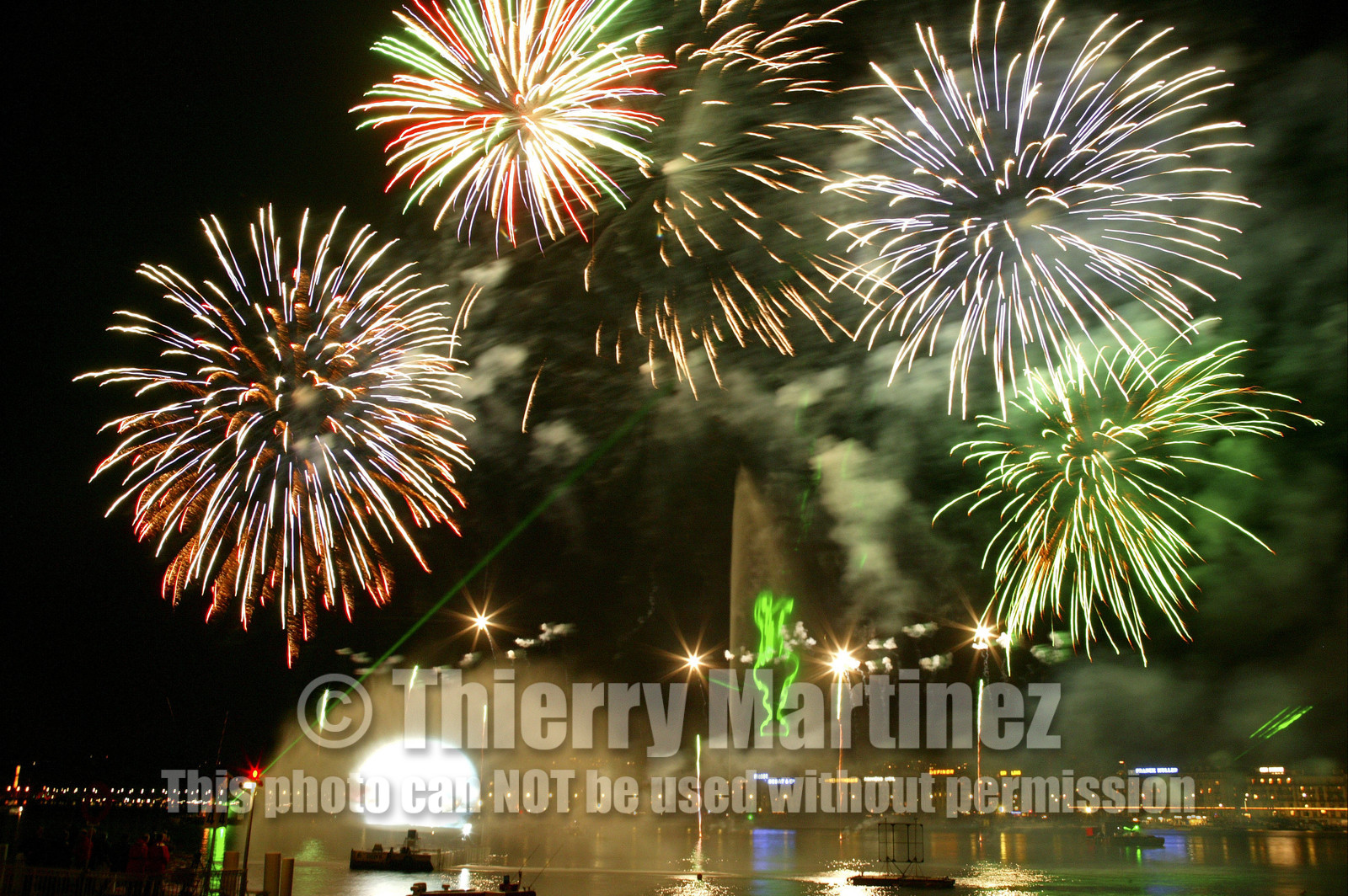 03_2278D ©Th.Martinez. Geneva , Switzerland. America's Cup 2003. 8th March 2003.Alinghi Team winner of America's Cup 2003..Welcome to Alinghi Team in Geneva.Firework and laser show by the lac...