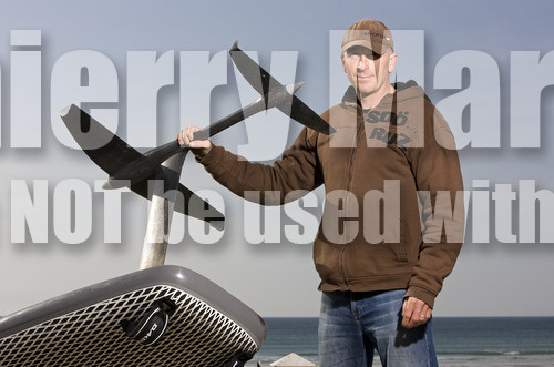 Bruno Andre (FRA) foiling with a windsurf.