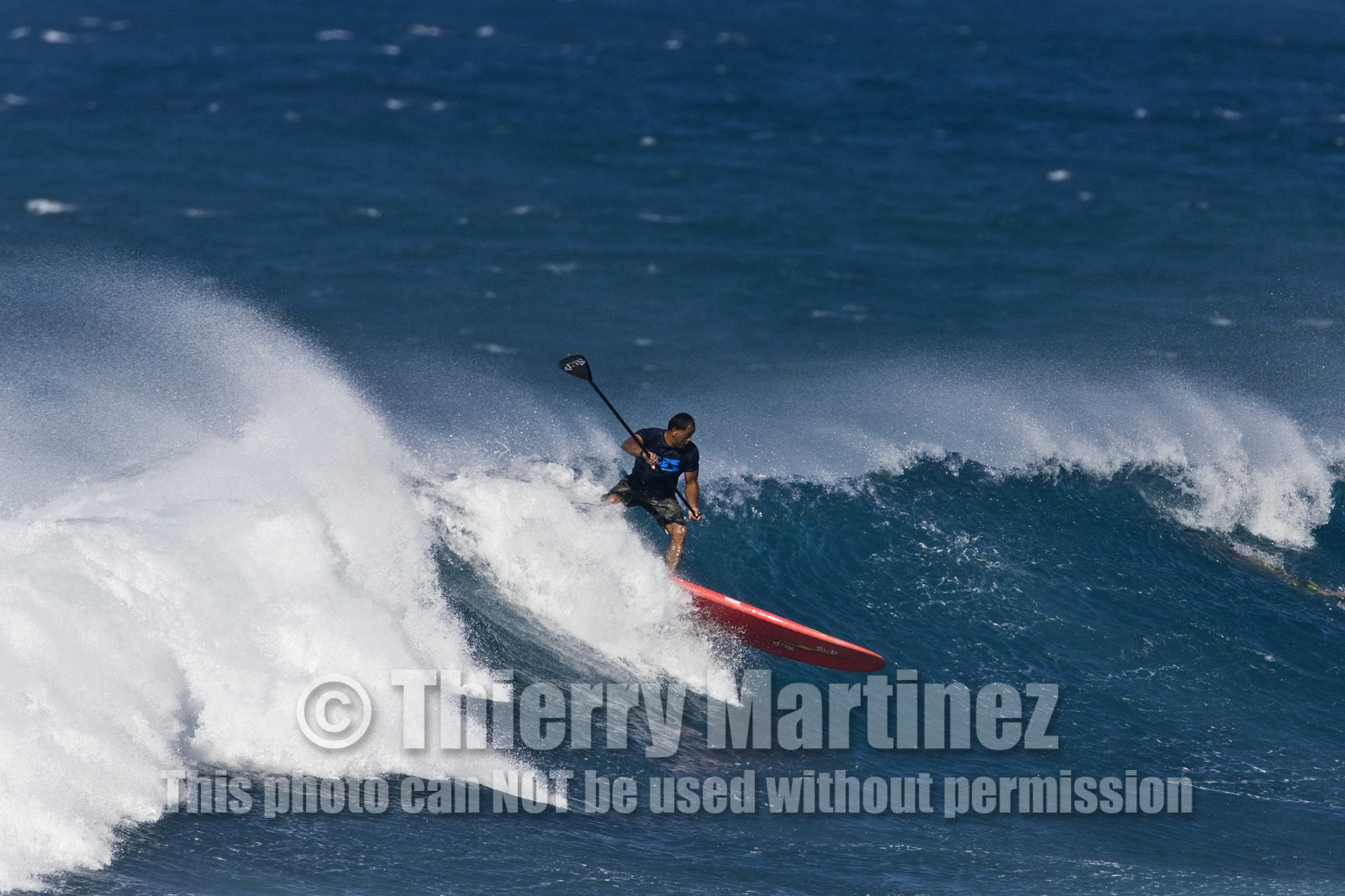Stand Up Paddle  in waves at Hookip'a Beach - North Shore Maui - Hawaii.