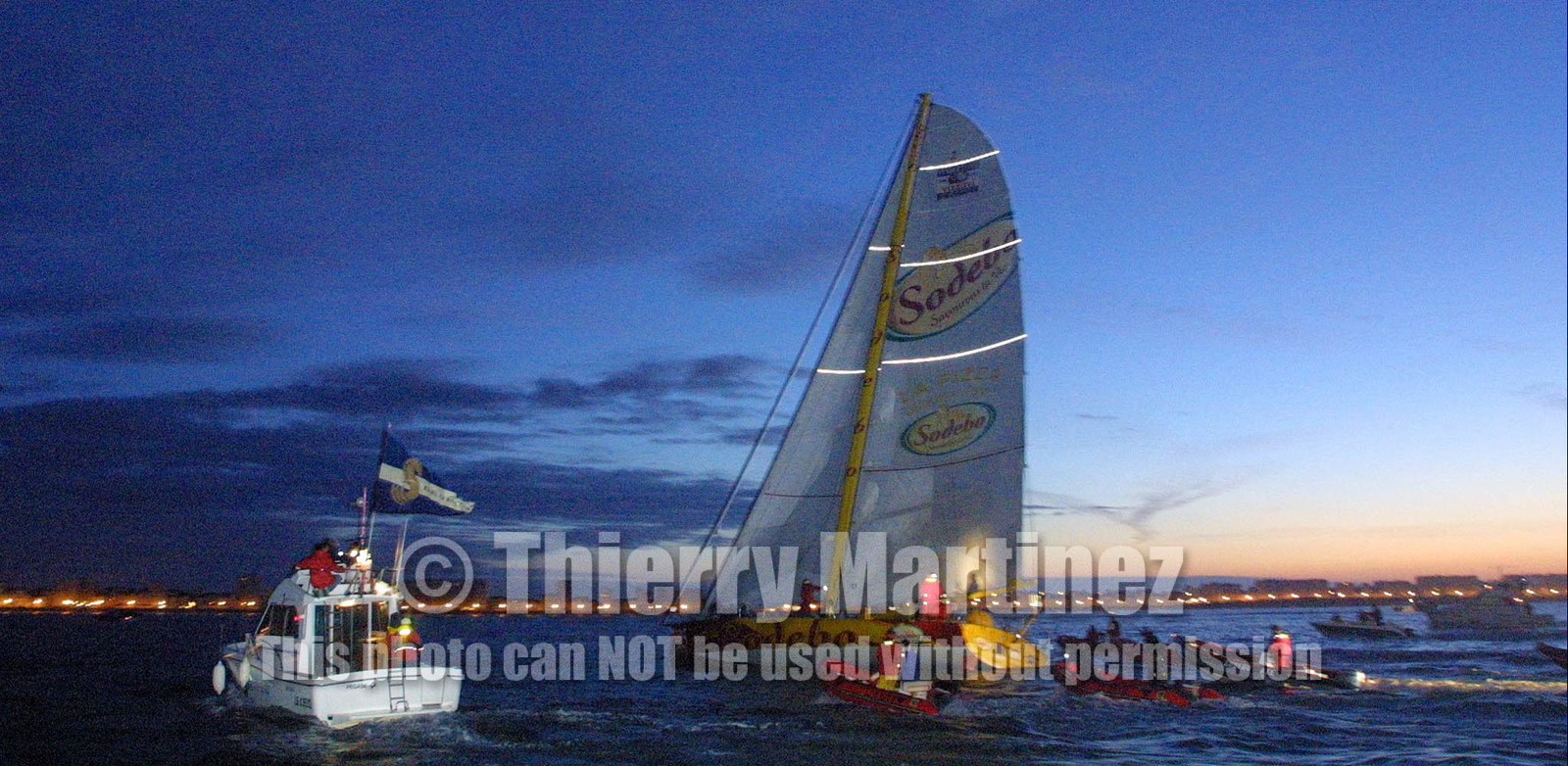 ©Thierry Martinez   Sea&Co.Vendee Globe Finish. les Sables d'Olonne (FRA) 23th february 2001. 07h15 (local time).Thomas Coville (FRA) SODEBO finishing 6th in single handed round the world race, in 105days 7h 24mn..Thomas had crossed the finish line at 23h35mn the day before.
