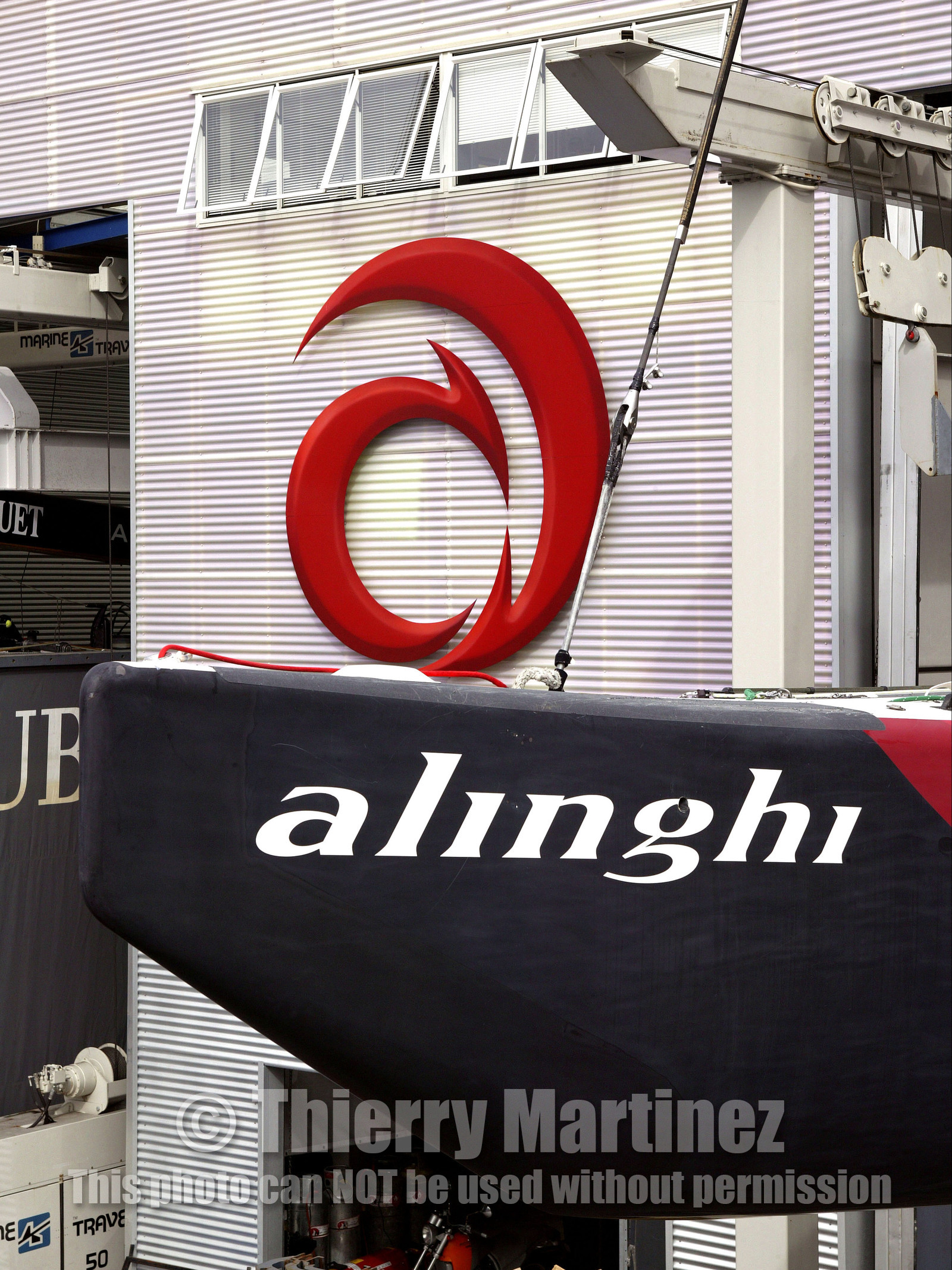 03_1063D © Th.Martinez Auckland   New Zealand. 24th February 2003  America's Cup 2003. Day 4, Race cancelled lack of wind. Alinghi (SUI64) vs Team New Zealand (NZL82)For fourth times in row race day 4 of the America's Cup 2003 have been cancelled . The two race boat have been left in sheds. In the foreground SUI 64..