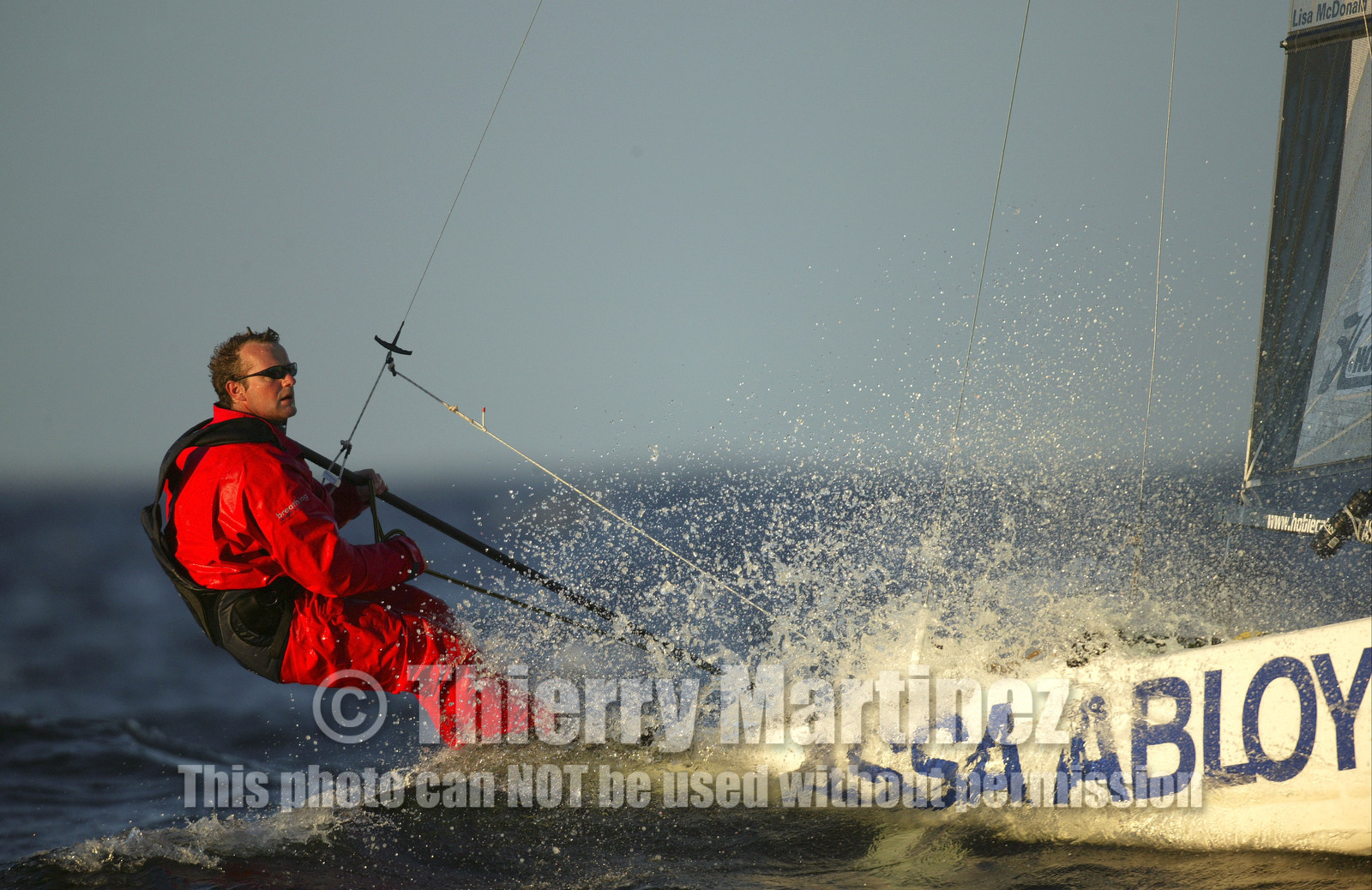 03_3217D © Th.Martinez,STOCKHOLMSWEDEN10 07 03-Archipelago Raid (2003). Leg 4, Marieham (Finland ) to Fejan (Sweden). Neal McDonad at the helm of ASSA ABLOY